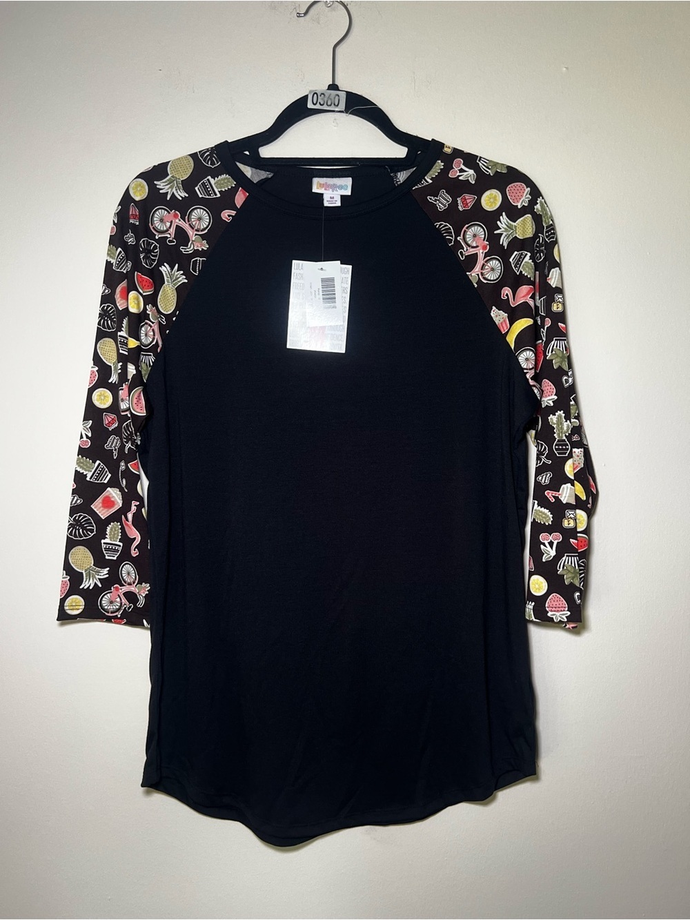 LuLaRoe Black Raglan Top with Summer Themed Patterned Sleeves